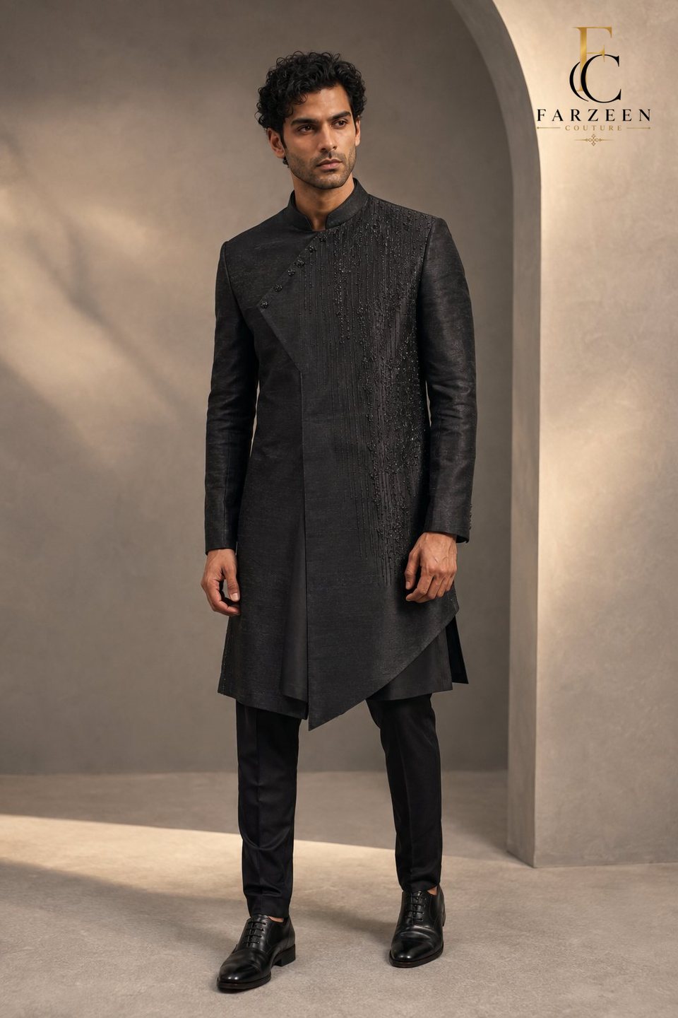 Man in a charcoal asymmetric Indo-Western with black beadwork