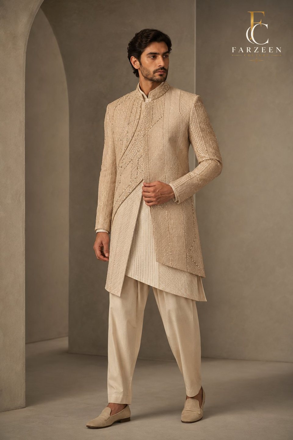 Man in a sand-coloured layered longline with tonal beadwork
