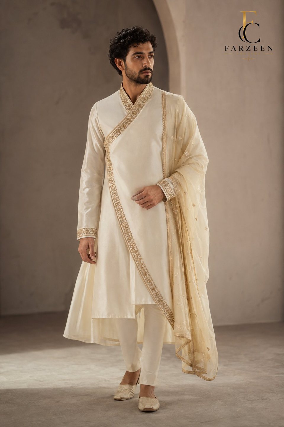 Man in an ivory layered angarkha with a gold-bordered shawl