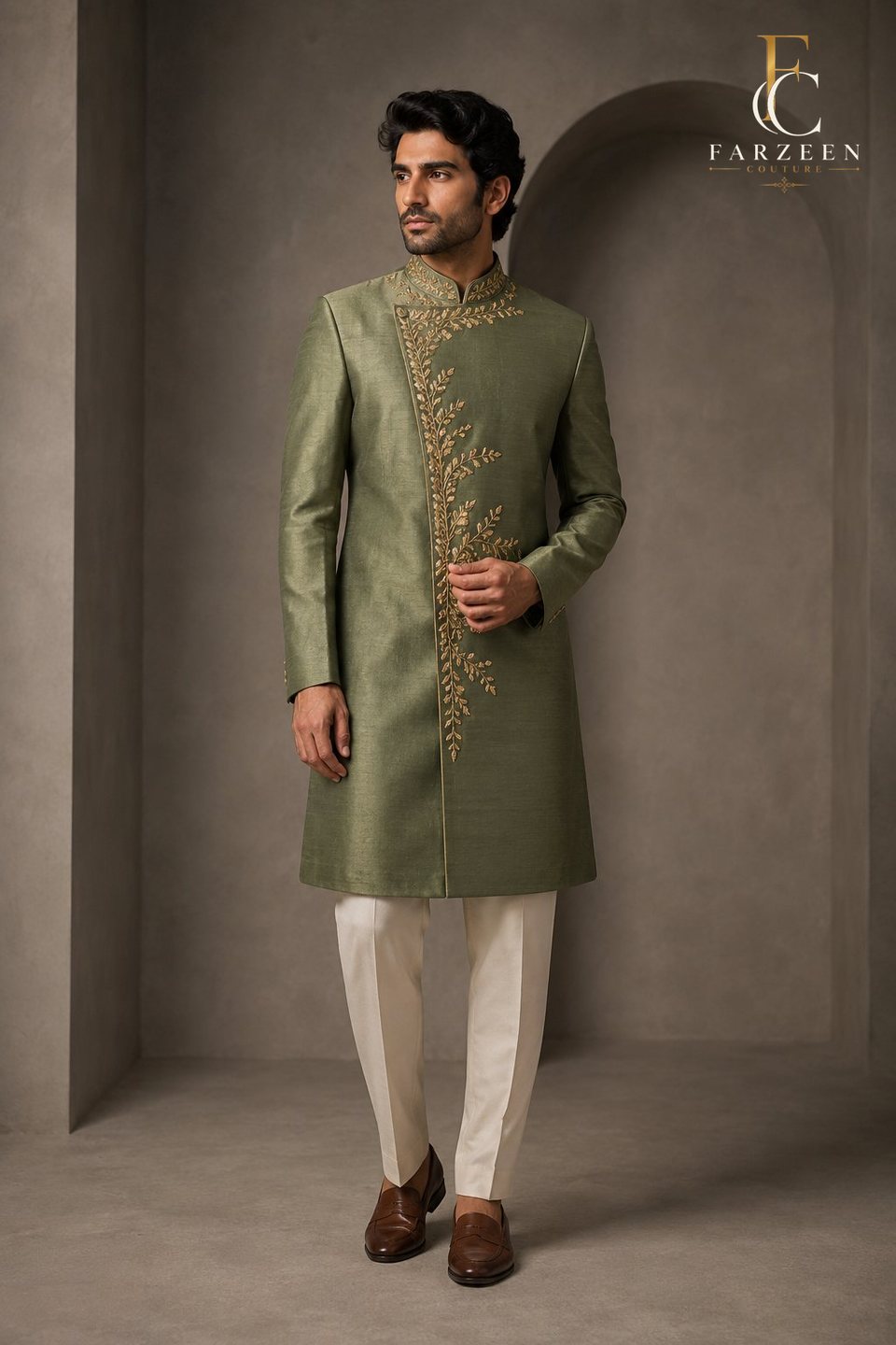 Man in a laurel-green asymmetric achkan with an antique-gold vine embroidery