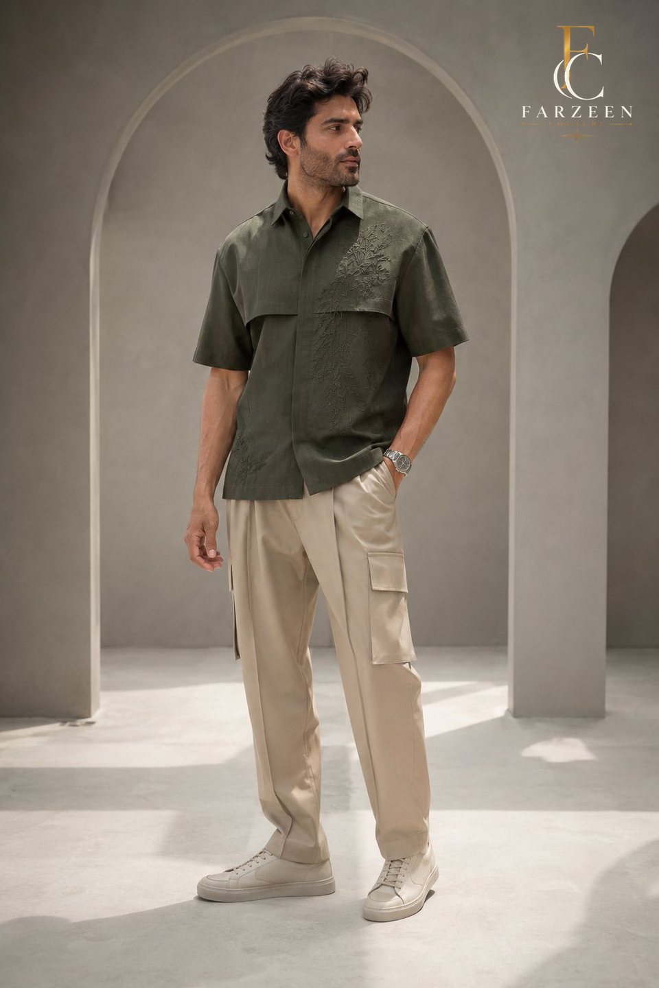Man in a laurel-green short-sleeve shirt and sand cargo trousers
