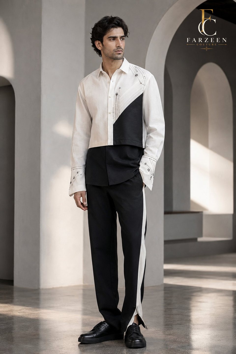 Man in a black and ivory colour-block shirt and split trousers